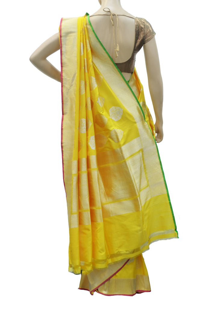 Sizzling Yellow with plain golden border saree
